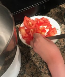 Dicing tomatoes for ranch chicken tacos