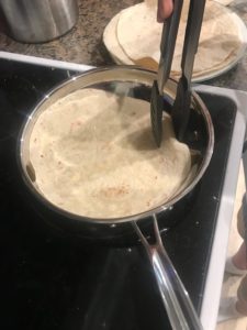 Warming tortillas for Whis-Kid ranch chicken tacos