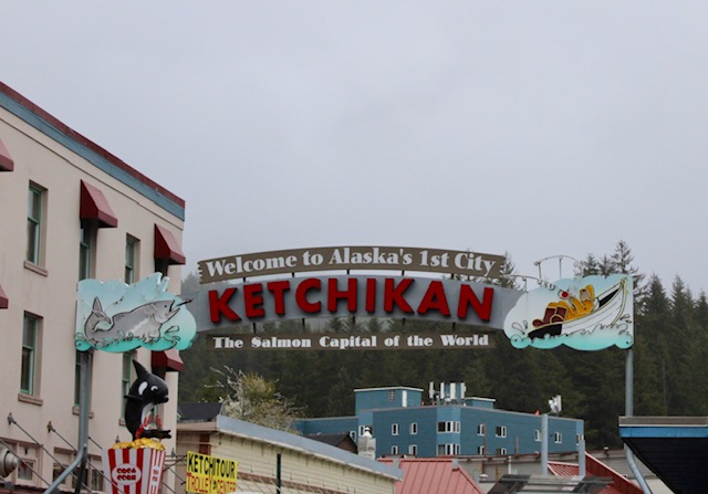 A sign spans the width of the street, welcoming visitors to Ketchikan. 